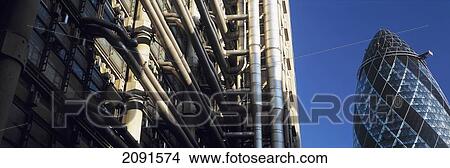 Looking Past The Lloyds Building Towards Norman Fosters 'gherkin' Or Swiss Re Building, London, Uk. View Large Photo Image Picture - Looking Past The Lloyds Building Towards Norman Fosters 'gherkin' Or Swiss Re Building, London, Uk.. Fotosearch