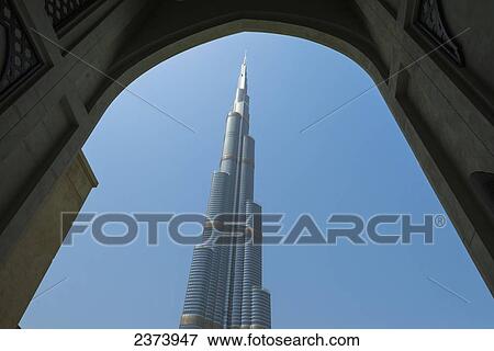 Stock Photo - Looking through arch to the Burj Khalifa; Dubai, United Arab Emirates. Fotosearch