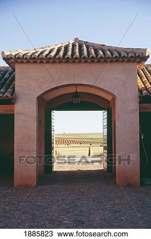 Stock Image - Looking Through Archway To Fields. Fotosearch