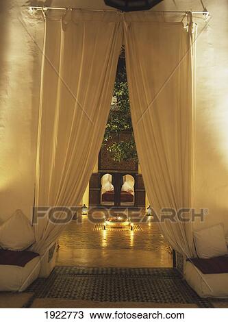 Looking Through Doorway To Candlelit Courtyard Of The Riad Dar Zelije View Large Photo Image Stock Image - Looking Through Doorway To Candlelit Courtyard Of The Riad Dar Zelije. Fotosearch