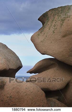 Picture - Looking Through Hole In Rocks Of The Cote De Granit Rose To Small Yacht. Fotosearch