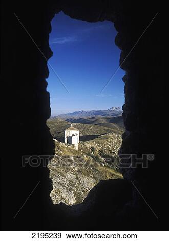 Stock Photo - Looking Through Hole In The Wall Of The Castle Of Rocca Calascio To The Chapel Of St Maria Delle Pieta, Abruzzo, Italy.. Fotosearch