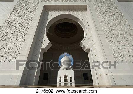 Stock Image - Looking Through Main Entrance To Courtyard Of The Sheikh Zayed Grand Mosqueabu Dhabi, United Arab Emirates. Fotosearch