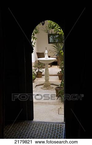 Looking through ornate doorway to courtyard of Riad Dar Hanane; Marrakesh, Morocco View Large Photo Image Stock Image - Looking through ornate doorway to courtyard of Riad Dar Hanane; Marrakesh, Morocco. Fotosearch