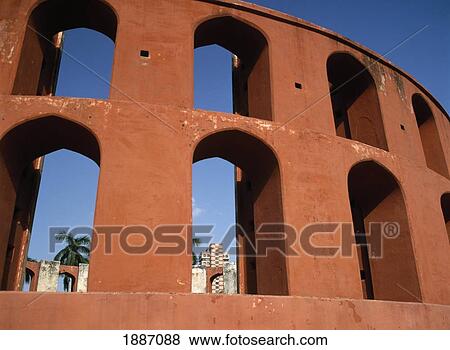 Stock Photo - Looking Through Part Of The Jantar Mantar Observatory Towards The Office Blocks. Fotosearch
