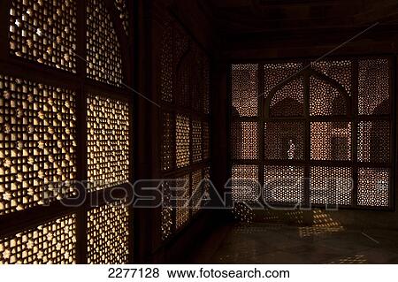 Looking through stone lattice wall to man praying in the Jami Masjid; Fatehpur Sikri, Agra, India View Large Photo Image Stock Photo - Looking through stone lattice wall to man praying in the Jami Masjid; Fatehpur Sikri, Agra, India. Fotosearch