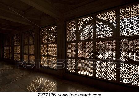 Stock Photograph - Looking through stone lattice walls in the Jami Masjid; Fatehpur Sikri, Agra, India. Fotosearch