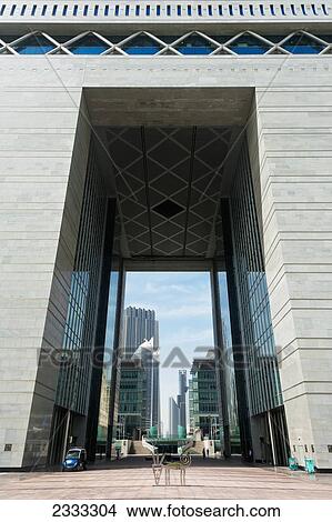 Picture - Looking Through The Arch Of Difc (Dubai International Financial Centre) Building; Dubai, United Arab Emirates. Fotosearch