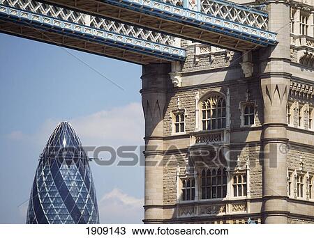 Stock Image - Looking Through Tower Bridge To The Swiss Re Building, London, Uk.. Fotosearch