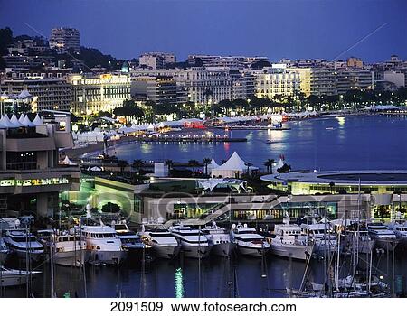 Stock Photo - Looking Through Yachts In The Harbour Of Cannes, France.. Fotosearch
