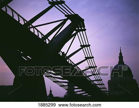 Stock Photo - Looking Towards The Millennium Bridge At Dusk Towards St Paul's Cathedral. Fotosearch