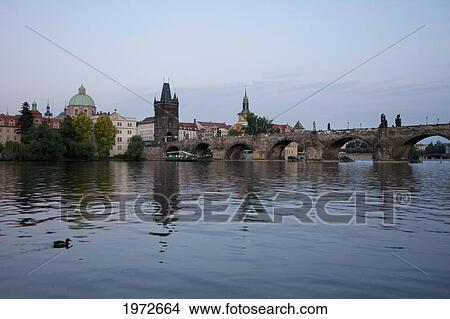 Picture - Loon And Stare Mesto Tower Of The Charles Bridge Over The Vltava River At Dusk, Prague, Czech Republic. Fotosearch