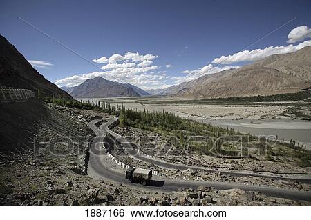 Lorry Driving Along A Winding Road In The Mountains View Large Photo Image Stock Photograph - Lorry Driving Along A Winding Road In The Mountains. Fotosearch