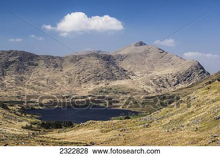 Stock Photo - Lough Brin with Mullaghattin mountain behind, MacGillycuddy's Reeks; Iveragh Peninsula, County Kerry, Ireland, UK. Fotosearch