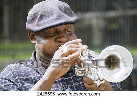 Louisiana, New Orleans, A street performer plays the trumpet View Large Photo Image Stock Photograph - Louisiana, New Orleans, A street performer plays the trumpet. Fotosearch