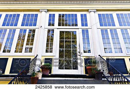 Stock Photo - Louisiana, New Orleans, Detail of windows on a residential facade.. Fotosearch