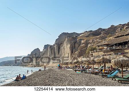 Lounge chairs on a beach; Santorini, Greece View Large Photo Image Picture - Lounge chairs on a beach; Santorini, Greece. Fotosearch
