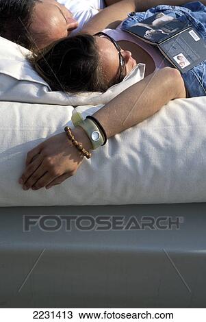 Lounge/Bed, Sunbathers, Couple, Book, Bloemendaal Beach Bar, Netherlands View Large Photo Image Stock Image - Lounge/Bed, Sunbathers, Couple, Book, Bloemendaal Beach Bar, Netherlands. Fotosearch