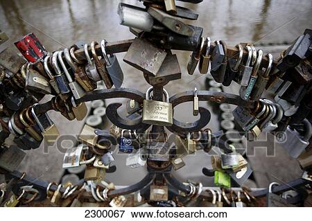 Love Lock Bridge in Baste Kalns Park. It is good luck and tradition for grooms to carry their brides over the 7 bridges in Riga and attach their lock to seal their love to one, Riga, Latvia. View Large Photo Image Stock Photo - Love Lock Bridge in Baste Kalns Park. It is good luck and tradition for grooms to carry their brides over the 7 bridges in Riga and attach their lock to seal their love to one, Riga, Latvia.. Fotosearch