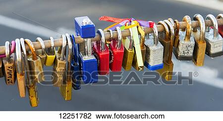 Love locks on a bar; New York City, New York, United States of America View Large Photo Image Stock Image - Love locks on a bar; New York City, New York, United States of America. Fotosearch