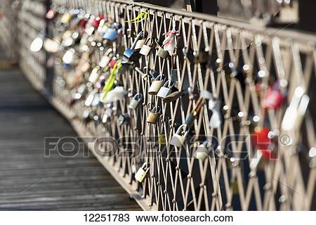 Stock Image - Love locks on a fence; New York City, New York, United States of America. Fotosearch