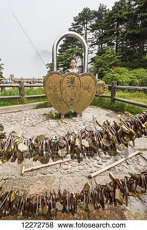 Stock Photo - Love locks on a viewpoint by the North Sea Scenic area, Mount Huangshan, Anhui, China. Fotosearch