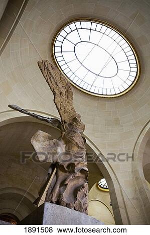 Stock Photo - Low Angle Of The Winged Victory Of Samothrace Sculpture In The Louvre; Paris, France. Fotosearch