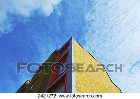 Low angle view of a brick residential building with a wavey roofline, Brick Lane; London, England View Large Photo Image Stock Image - Low angle view of a brick residential building with a wavey roofline, Brick Lane; London, England. Fotosearch