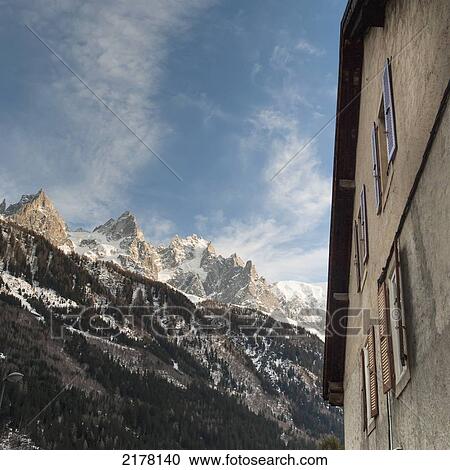 Stock Image - Low Angle View Of A Building Beside The French Alps; Chamonix-Mont-Blanc Rhone-Alpes France. Fotosearch