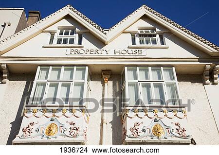 Low Angle View Of A Building Labeled Property House; Cork City County Cork Ireland View Large Photo Image Picture - Low Angle View Of A Building Labeled Property House; Cork City County Cork Ireland. Fotosearch