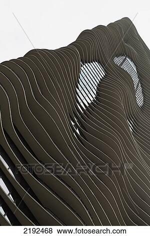 Stock Photo - Low Angle View Of A Building With Curved Ledges For A Wavy Facade; Chicago Illinois United States Of America. Fotosearch