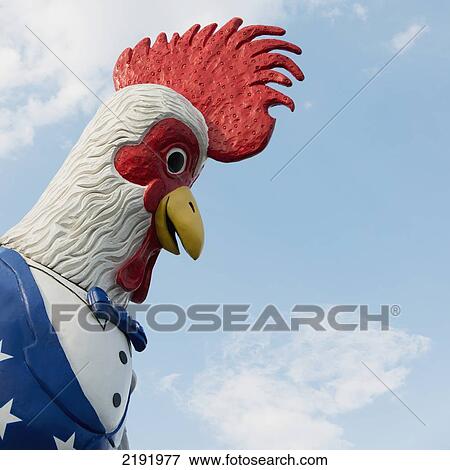 Stock Photo - Low Angle View Of A Colourful Sculpture Of A Rooster; Branson Missouri United States Of America. Fotosearch