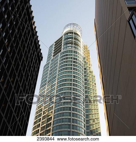 Low angle view of a condominium and office tower skyscrapers; Vancouver, British Columbia, Canada View Large Photo Image Picture - Low angle view of a condominium and office tower skyscrapers; Vancouver, British Columbia, Canada. Fotosearch