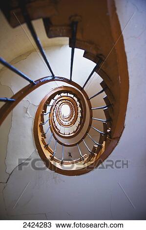 Low angle view of a curved railing on a winding staircase, Marais district; Paris, France View Large Photo Image Stock Image - Low angle view of a curved railing on a winding staircase, Marais district; Paris, France. Fotosearch