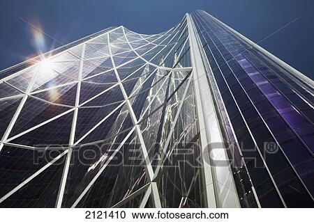 Low Angle View Of A Glass Building Reflecting The Sun With Diamond Design Metal Exterior And Blue Sky; Calgary Alberta Canada View Large Photo Image Stock Image - Low Angle View Of A Glass Building Reflecting The Sun With Diamond Design Metal Exterior And Blue Sky; Calgary Alberta Canada. Fotosearch