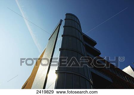 Low angle view of a modern building and a blue sky; Hamburg, Germany View Large Photo Image Stock Photo - Low angle view of a modern building and a blue sky; Hamburg, Germany. Fotosearch
