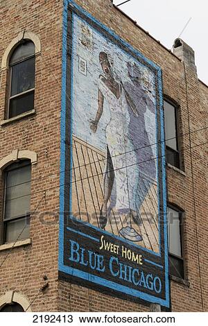 Stock Image - Low Angle View Of A Painted Sign For Sweet Home Blue Chicago On The Side Of A Brick Building; Chicago Illinois United States Of America. Fotosearch