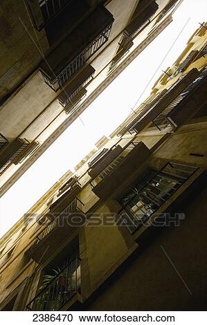 Low angle view of a residential building and the balconies; Barcelona, Spain View Large Photo Image Stock Image - Low angle view of a residential building and the balconies; Barcelona, Spain. Fotosearch