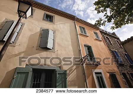 Low angle view of a residential building; Carcassonne, Languedoc-Rousillion, France View Large Photo Image Stock Photo - Low angle view of a residential building; Carcassonne, Languedoc-Rousillion, France. Fotosearch