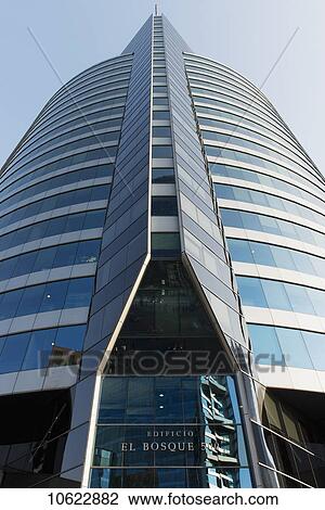 Low angle view of a skyscraper against a blue sky; Santiago, Santiago Metropolitan Region, Chile View Large Photo Image Stock Image - Low angle view of a skyscraper against a blue sky; Santiago, Santiago Metropolitan Region, Chile. Fotosearch