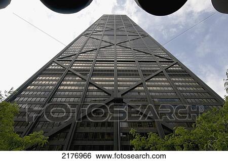 Low Angle View Of A Skyscraper Against A Blue Sky With Clouds; Chicago Illinois United States Of America View Large Photo Image Stock Photograph - Low Angle View Of A Skyscraper Against A Blue Sky With Clouds; Chicago Illinois United States Of America. Fotosearch