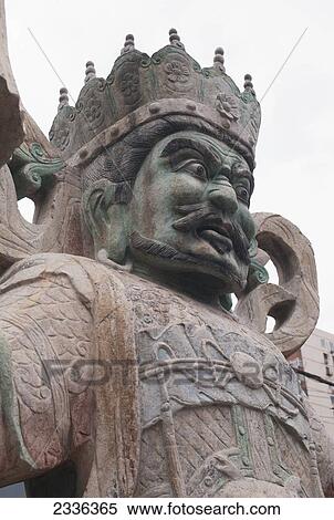 Stock Photography - Low Angle View Of A Statue Of A King At The Panjiayuan Antique Market; Beijing, China. Fotosearch