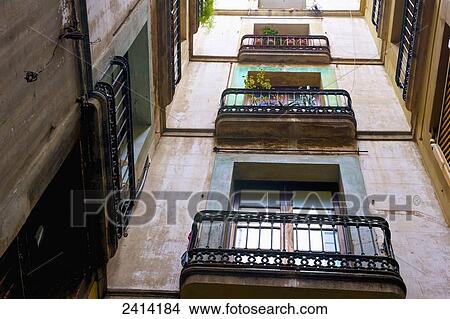 Picture - Low angle view of balconies on an apartment building; Barcelona, Spain. Fotosearch