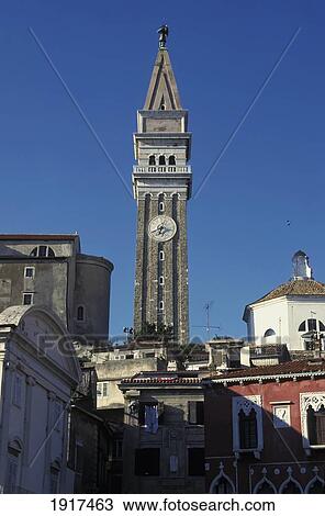 Stock Image - Low Angle View Of Clock Tower In Old Town. Fotosearch