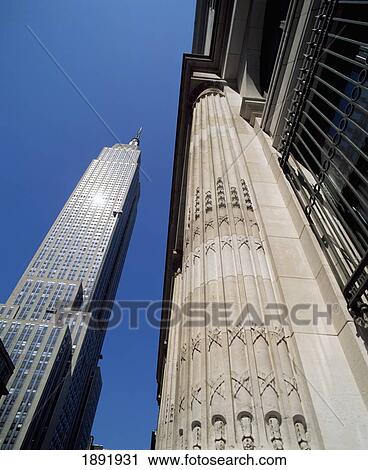 Stock Image - Low Angle View Of Empire State Building. Fotosearch