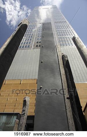 Low Angle View Of Skyscraper And Sculptures View Large Photo Image Stock Photo - Low Angle View Of Skyscraper And Sculptures. Fotosearch