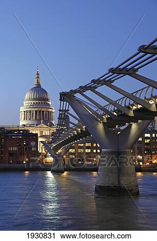 Low angle view of St Paul's Cathedral and the Millennium Bridge, River Thames, London, England, UK. View Large Photo Image Stock Image - Low angle view of St Paul's Cathedral and the Millennium Bridge, River Thames, London, England, UK.. Fotosearch