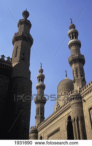 Stock Image - Low Angle View Of Sultan Hassan Mosque (Left) And Er Rifai Mosque (Right), Cairo, Egypt; Cairo, Egypt. Fotosearch
