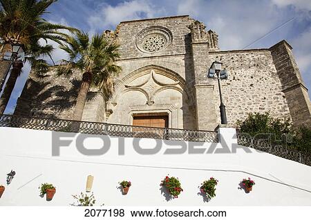 Stock Photo - Low Angle View Of The Front Entrance Of A Building; Vejer De La Frontera Andalusia Spain. Fotosearch