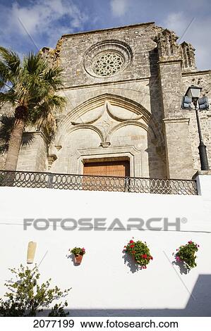 Low Angle View Of The Front Entrance Of A Building; Vejer De La Frontera Andalusia Spain View Large Photo Image Stock Photo - Low Angle View Of The Front Entrance Of A Building; Vejer De La Frontera Andalusia Spain. Fotosearch